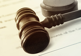 Gavel on legal document, symbolizing asset protection strategies.