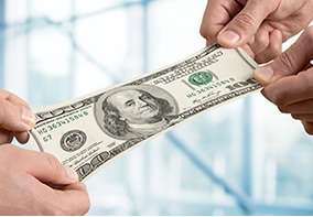 Hands exchanging hundred dollar bill for wealth transfer planning concept