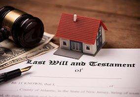 Wills and Trusts: Last Will document, gavel, house, money.