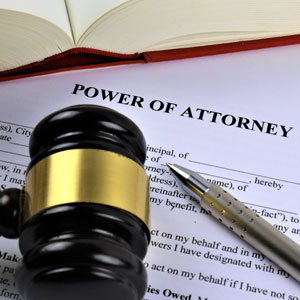 Power of attorney document with gavel and pen representing legal authority and planning
